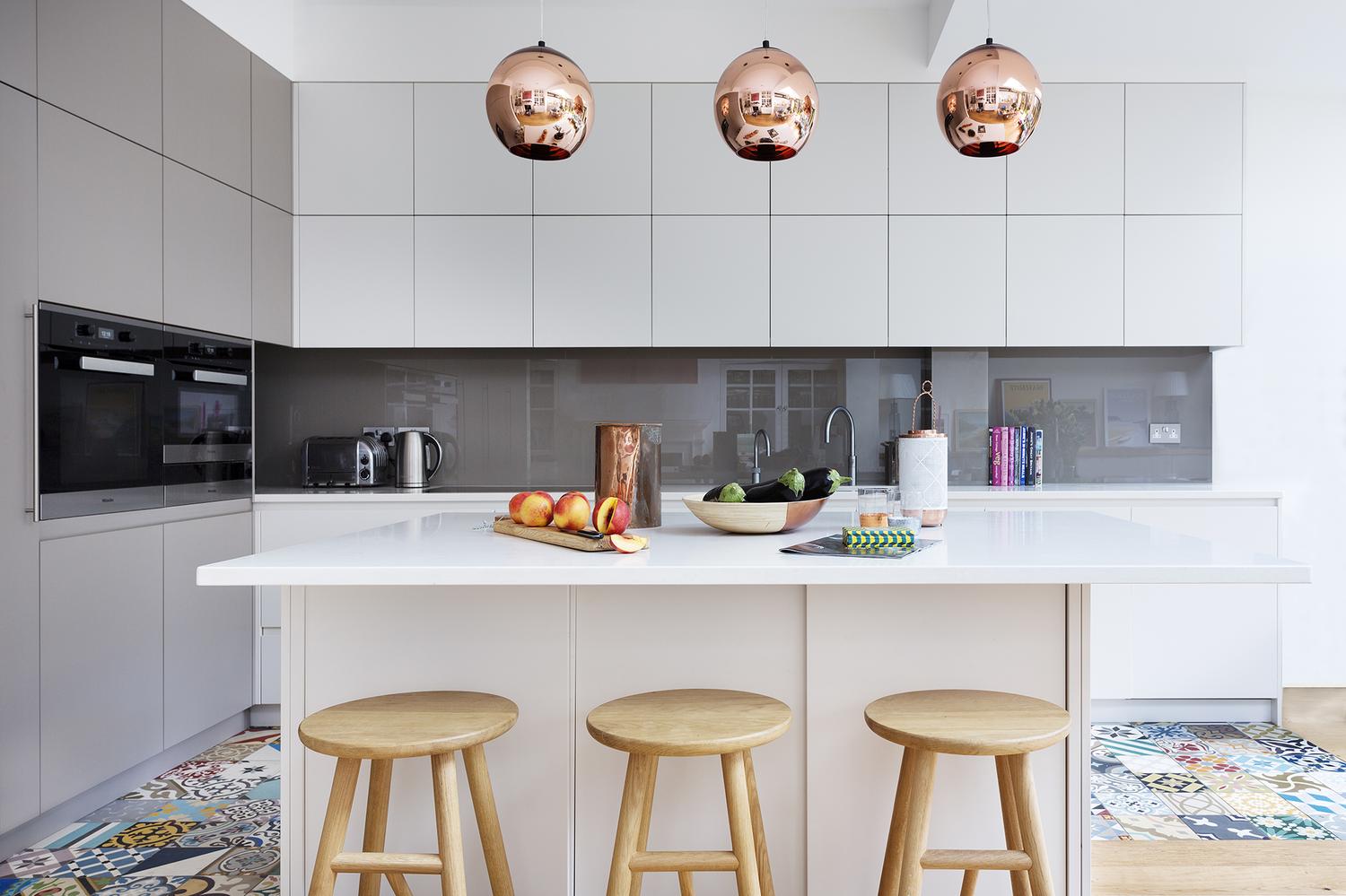 A Modern Kitchen Decor with Copper Lamps and Vintage Details