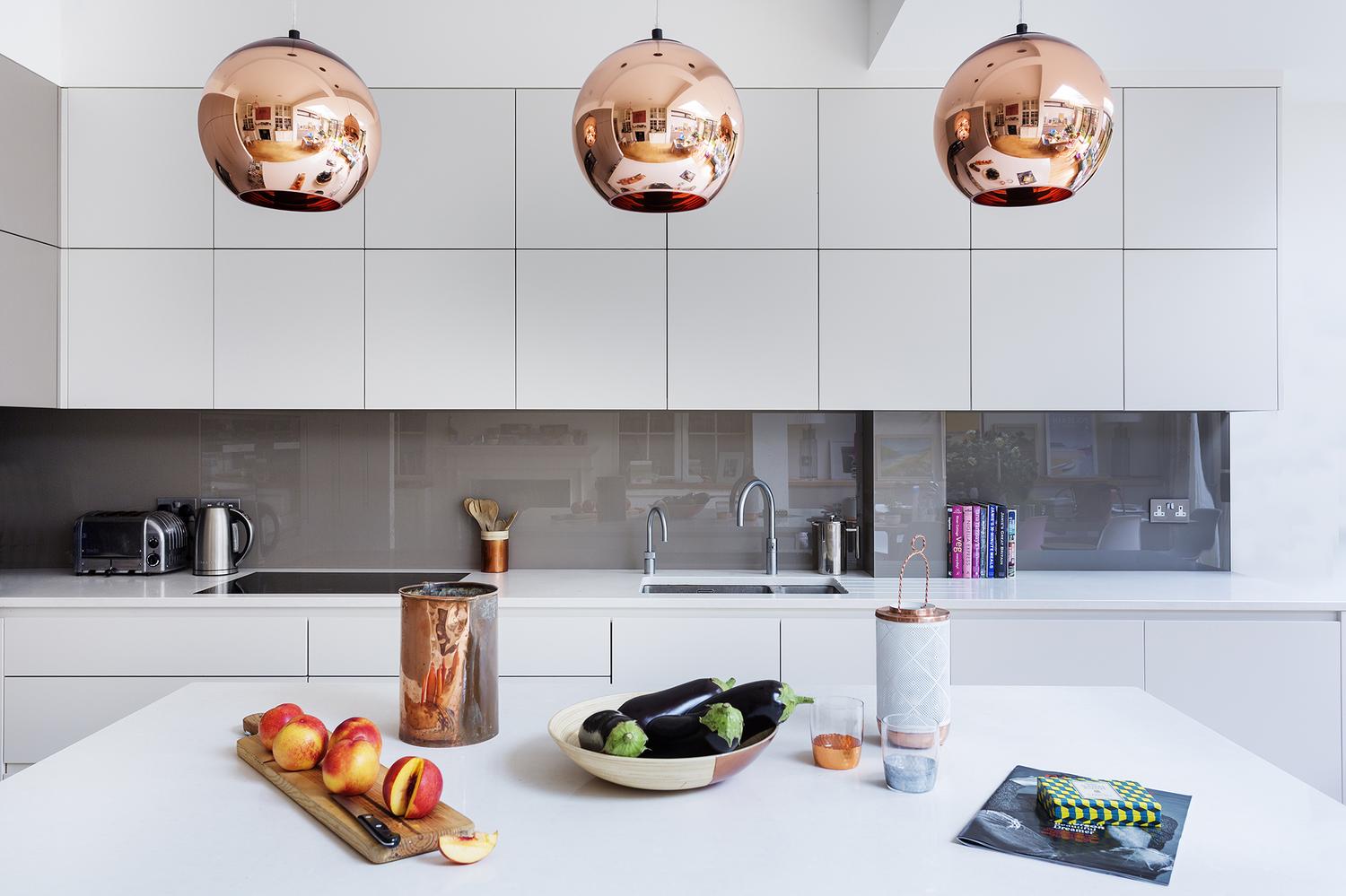 A Modern Kitchen Decor with Copper Lamps and Vintage Details